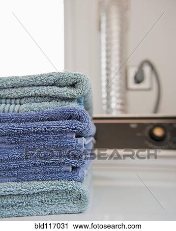 Folded Towels on a Dryer View Large Photo Image Stock Image - Folded Towels on a Dryer. Fotosearch