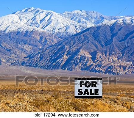 For Sale Sign in Mountainous, Desert Landscape View Large Photo Image Picture - For Sale Sign in Mountainous, Desert Landscape. Fotosearch