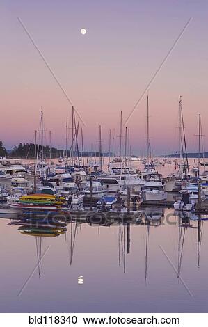 Stock Image - Full Moon Over Ganges Harbor. Fotosearch