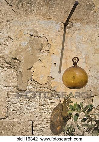 Glass Ball Hanging from Plaster Wall View Large Photo Image Stock Image - Glass Ball Hanging from Plaster Wall. Fotosearch