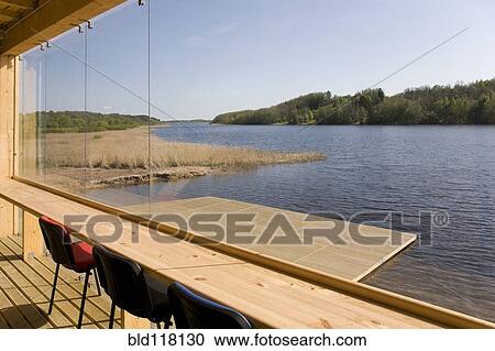 Stock Image - Lakeside Building And Dock. Fotosearch