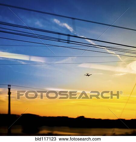 Landing Plane at Sunset View Large Photo Image Stock Image - Landing Plane at Sunset. Fotosearch