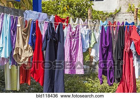 Stock Photograph - Laundry. Clothing hanging out to dry on a line in Cancun. Fotosearch