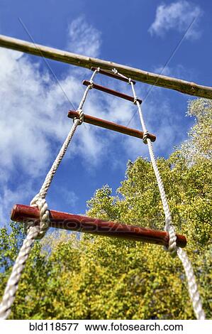 Low angle view of a rope ladder suspended from a pole View Large Photo Image Stock Photo - Low angle view of a rope ladder suspended from a pole. Fotosearch