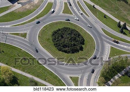 Major roads and dual carriageways and a roundabout with a small number of cars View Large Photo Image Stock Image - Major roads and dual carriageways and a roundabout with a small number of cars. Fotosearch