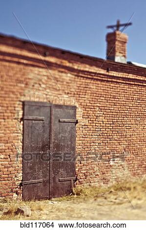 Picture - Metal Door in Brick Facade. Fotosearch