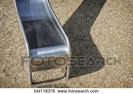Metal playground slide in a playground View Large Photo Image Stock Photo - Metal playground slide in a playground. Fotosearch