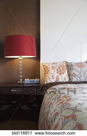 Nightstand and Lamp Next to a Bed View Large Photo Image Stock Photo - Nightstand and Lamp Next to a Bed. Fotosearch