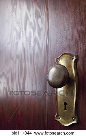 Old-fashioned Doorknob on a Wooden Door View Large Photo Image Picture - Old-fashioned Doorknob on a Wooden Door. Fotosearch