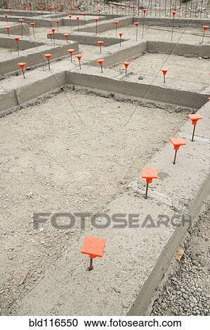 Orange Caps in Cement Foundation View Large Photo Image Stock Image - Orange Caps in Cement Foundation. Fotosearch