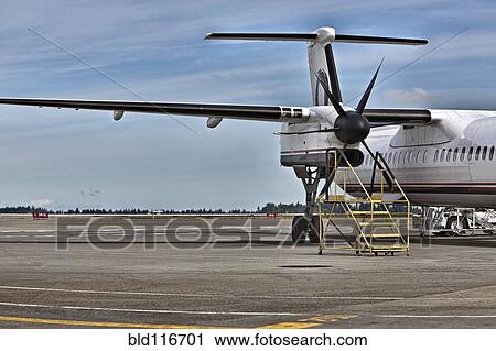 Stock Image - Prop Plane on the Tarmac. Fotosearch