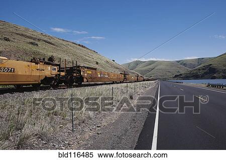 Railroad cars and highway along the Snake River View Large Photo Image Stock Photography - Railroad cars and highway along the Snake River . Fotosearch