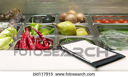 Receipts booklet on the counter of a fresh ingredients display View Large Photo Image Stock Photography - Receipts booklet on the counter of a fresh ingredients display. Fotosearch