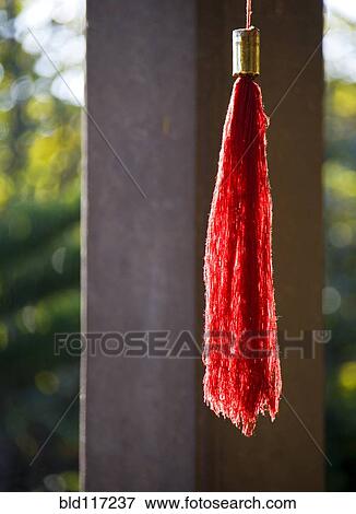 Stock Photo - Red Tassel at Buddhist Temple. Fotosearch