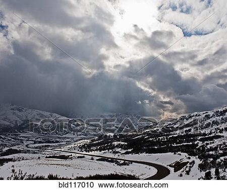 Road Through a Snowy Mountain Landscape View Large Photo Image Stock Image - Road Through a Snowy Mountain Landscape. Fotosearch
