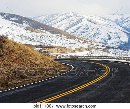 Road Through a Snowy Mountain Landscape View Large Photo Image Stock Photo - Road Through a Snowy Mountain Landscape. Fotosearch