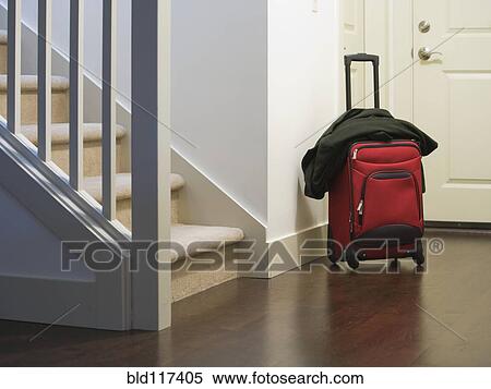 Stock Photography - Rolling Luggage at the Front Door. Fotosearch
