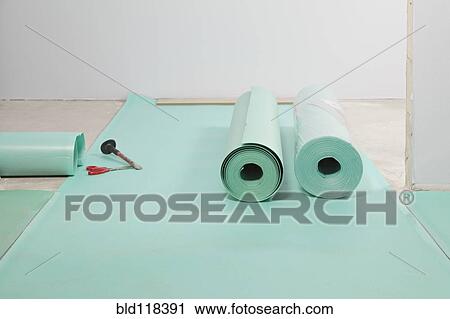 Rolls of underlay, or sub-flooring material, and a partly installed laminate floor View Large Photo Image Stock Image - Rolls of underlay, or sub-flooring material, and a partly installed laminate floor. Fotosearch