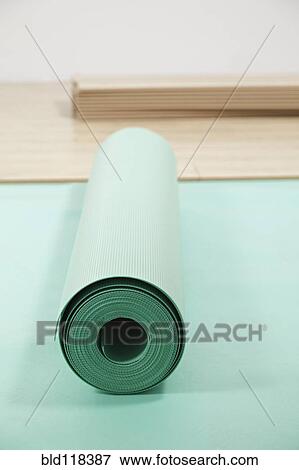 Rolls of underlay, or sub-flooring material, and a partly installed laminate floor View Large Photo Image Stock Photo - Rolls of underlay, or sub-flooring material, and a partly installed laminate floor. Fotosearch