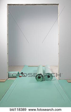Rolls of underlay, or sub-flooring material, and a partly installed laminate floor View Large Photo Image Stock Photo - Rolls of underlay, or sub-flooring material, and a partly installed laminate floor. Fotosearch