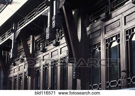 Stock Image - Rows of Wood Doors on Ornate Building Exterior. Fotosearch