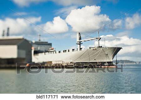 Stock Image - Ship and Loading Dock at a Seaport. Fotosearch