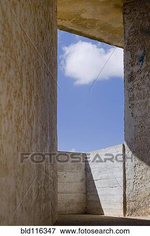 Stock Photo - Sky Seen Through Concrete Window. Fotosearch