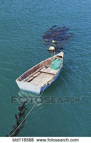 Small dinghy floats View Large Photo Image Stock Photo - Small dinghy floats. Fotosearch