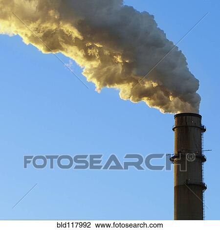 Stock Image - Smokestack Billowing Smoke. Fotosearch