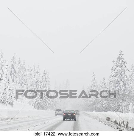 Stock Image - Snow-Covered Rural Highway. Fotosearch