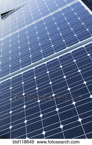 Solar panels fixed on the rooftop of a house View Large Photo Image Stock Photo - Solar panels fixed on the rooftop of a house . Fotosearch