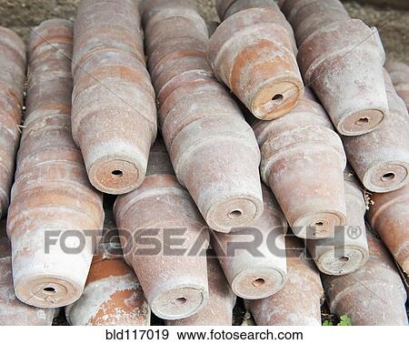 Stacks of Terracotta Potts View Large Photo Image Stock Photo - Stacks of Terracotta Potts. Fotosearch