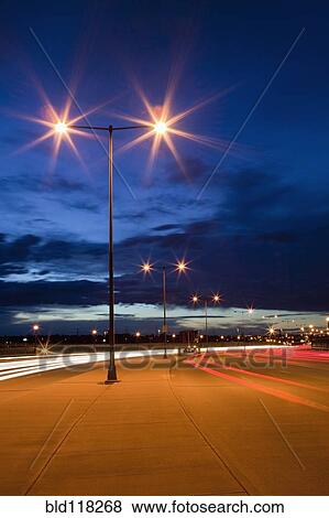 Stock Photo - Street Lights and Traffic at Dusk. Fotosearch