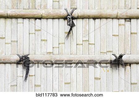 Stock Image - Sun Bleached Bamboo Fence. Fotosearch
