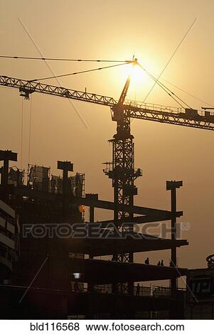 Sun Shining Behind a Construction Crane View Large Photo Image Stock Photo - Sun Shining Behind a Construction Crane. Fotosearch