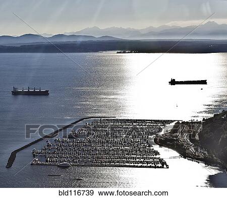Stock Photo - Sunlight Reflecting Off Of Water Near Marina. Fotosearch