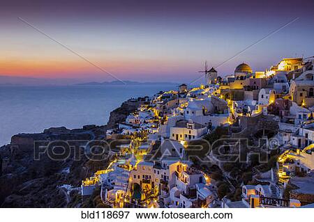 Sunset over the town of Oia View Large Photo Image Stock Photo - Sunset over the town of Oia. Fotosearch