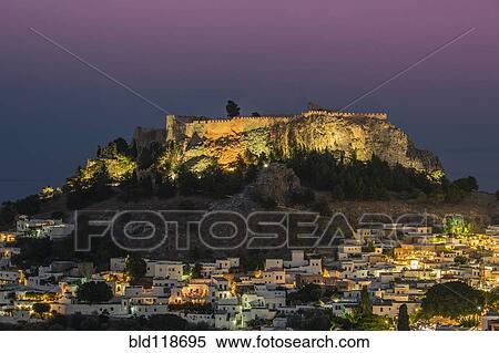 The acropolis above the small white houses of Lindos View Large Photo Image Stock Photography - The acropolis above the small white houses of Lindos. Fotosearch