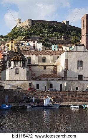 Stock Image - The historic town of Bosa with buildings painted in bright colors. Fotosearch