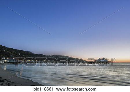 Stock Image - The view out to see from Malibu pier at sunrise. Fotosearch