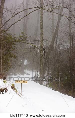 Stock Image - Trailhead Covered With Snow. Fotosearch