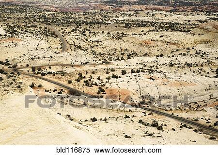 Stock Photography - Two Lane Road Passing Through the Desert. Fotosearch