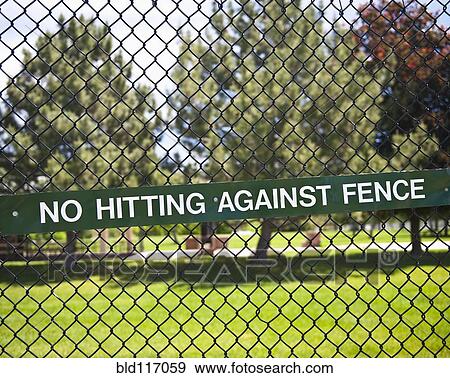 Stock Photo - Warning Sign on Chain Fence. Fotosearch