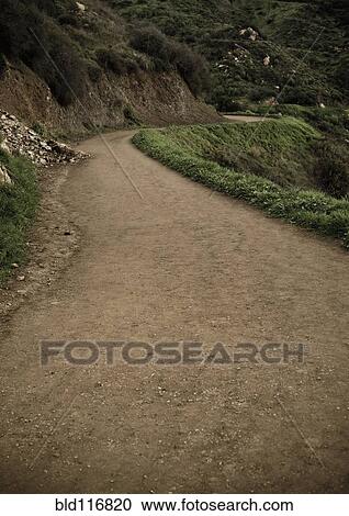 Stock Image - Winding Dirt Road. Fotosearch