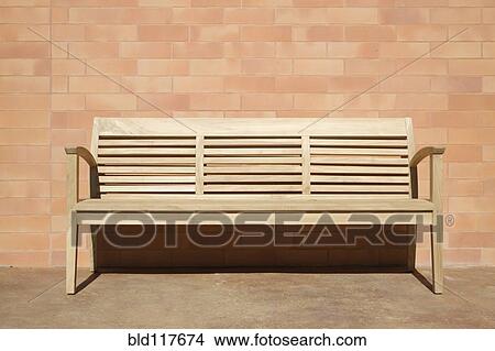 Wooden Bench Set Against Brick Wall View Large Photo Image Picture - Wooden Bench Set Against Brick Wall. Fotosearch