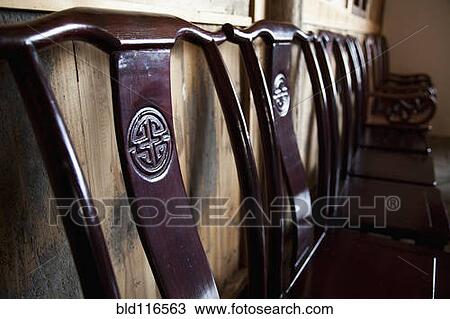 Wooden Chairs Against a Wall View Large Photo Image Stock Image - Wooden Chairs Against a Wall. Fotosearch