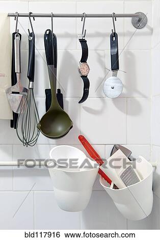 Wrist watch hanging amongst various kitchen tools View Large Photo Image Stock Photograph - Wrist watch hanging amongst various kitchen tools. Fotosearch