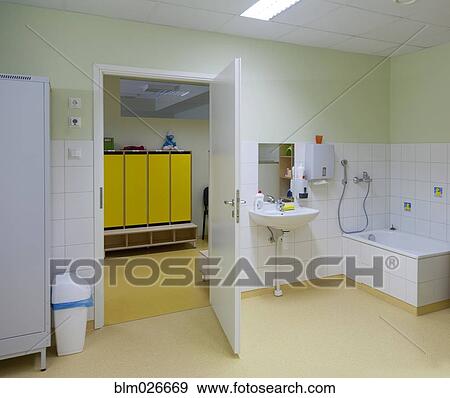 A bathroom, and shower, with hand basin and storage for pots View Large Photo Image Stock Photo - A bathroom, and shower, with hand basin and storage for pots. Fotosearch