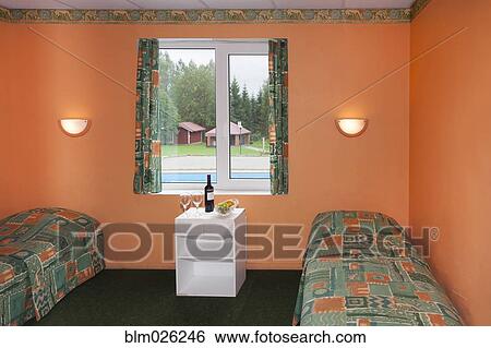 A bedroom with two beds View Large Photo Image Stock Photograph - A bedroom with two beds . Fotosearch