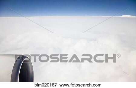 Stock Photo - A cloudscape while flying over continental Europe. Fotosearch